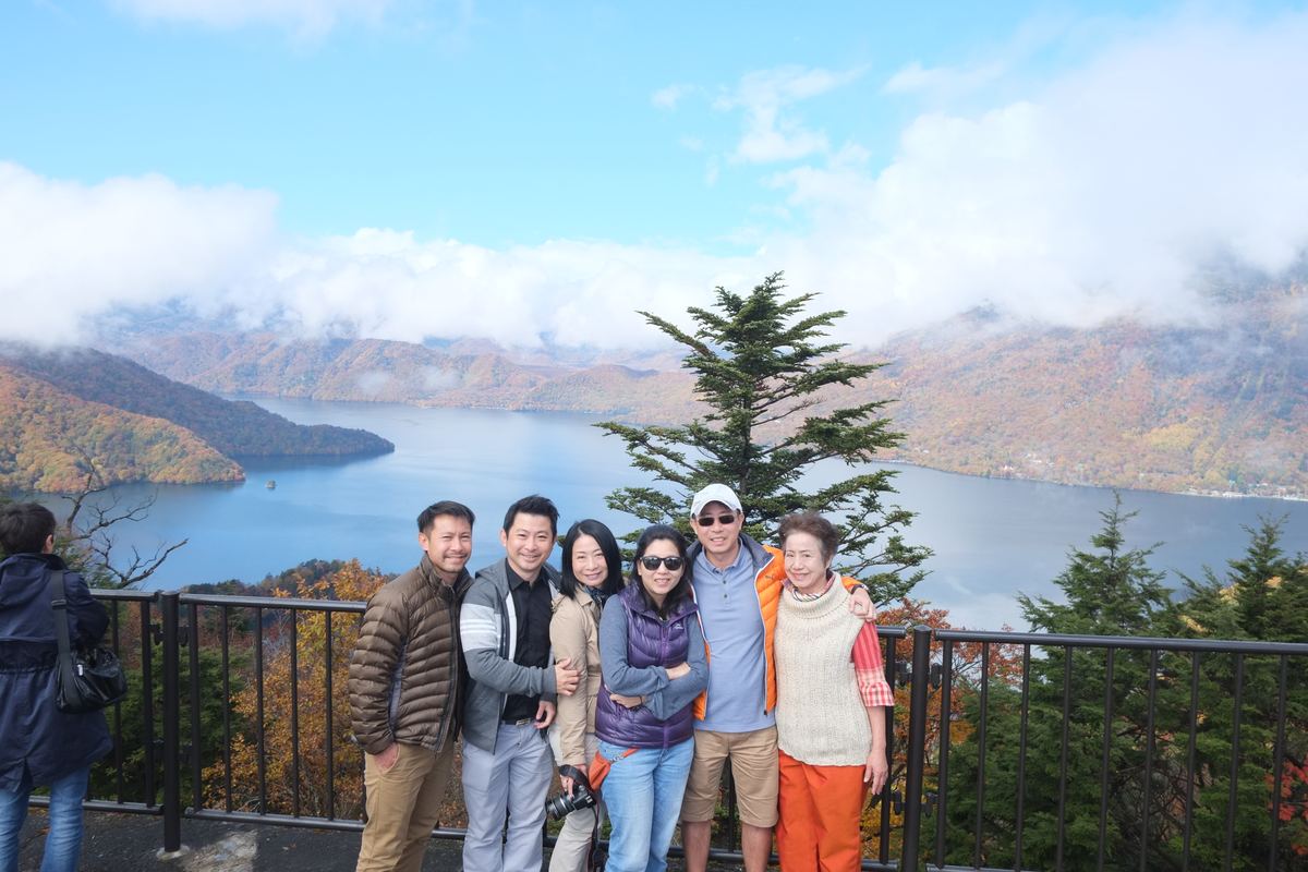 The whole family gathered before Mount Fuji